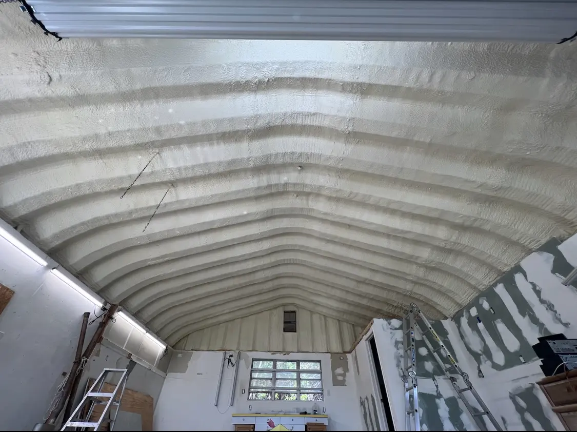 Spray polyurethane foam applied to the underside of a metal roof deck in Chehalis
